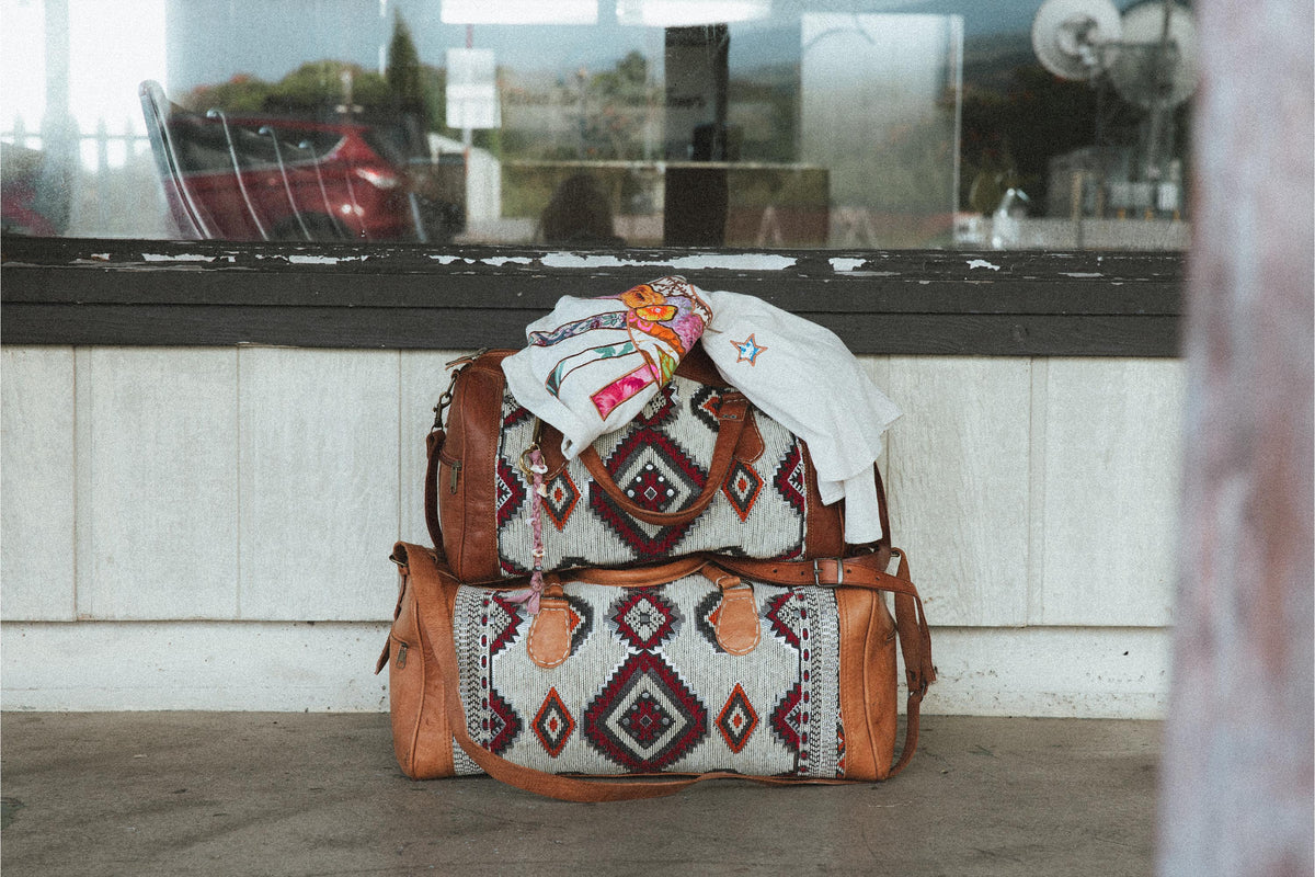 Kilim leather travel bags on the tarmac