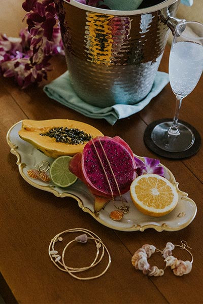 Tablescape with Reclining Mermaid Jewelry Tray and various Wings Hawaii jewelry