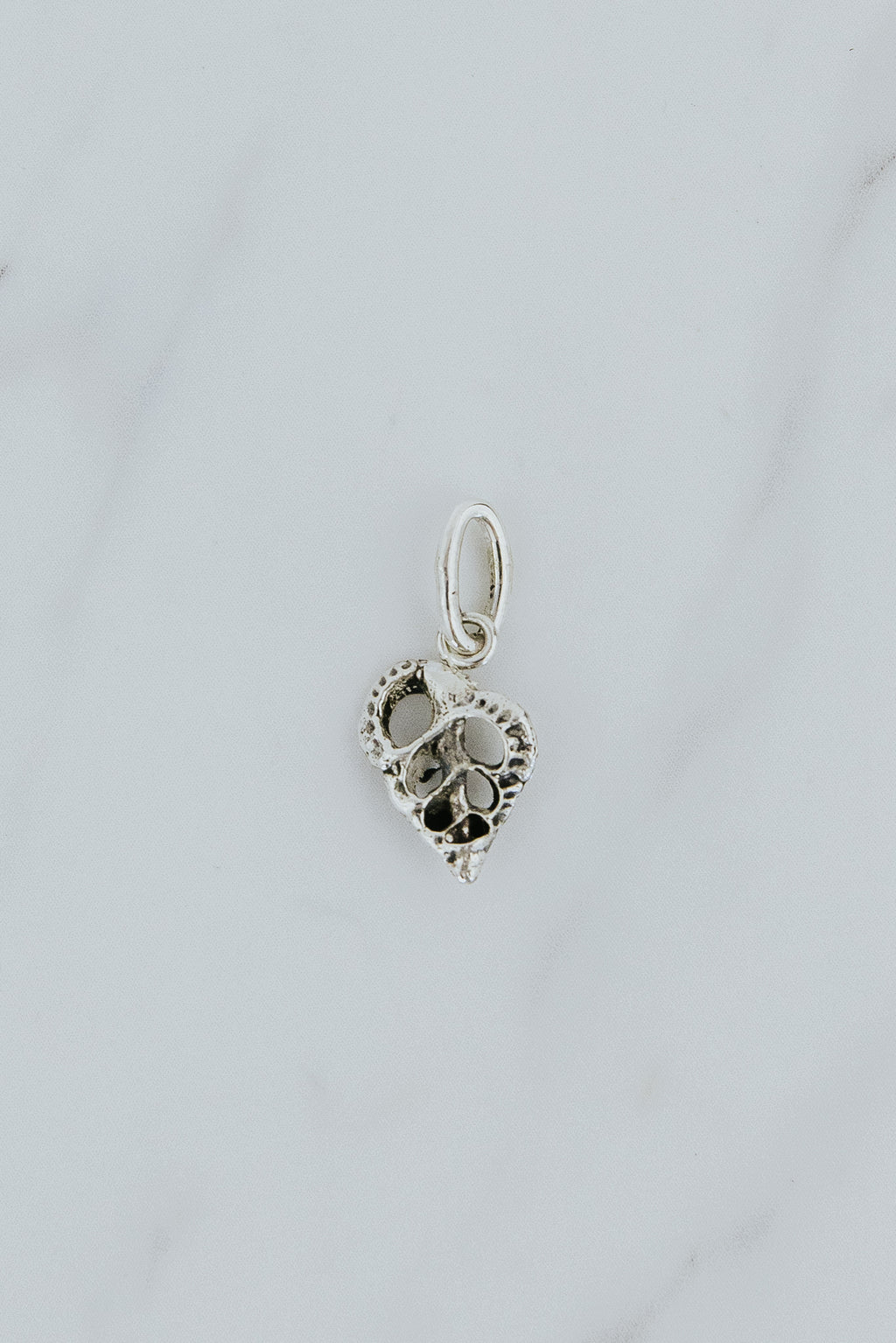 Wings Hawaii Forever Triton Shell cross-section necklace charm in sterling silver or solid 14k yellow gold. Fine jewelry handcrafted in Maui. Modern charm necklaces handmade in Hawaii. 