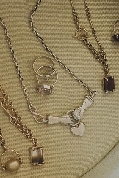 Wings Hawaii Stolen Heart Necklace in sterling silver, shown with others