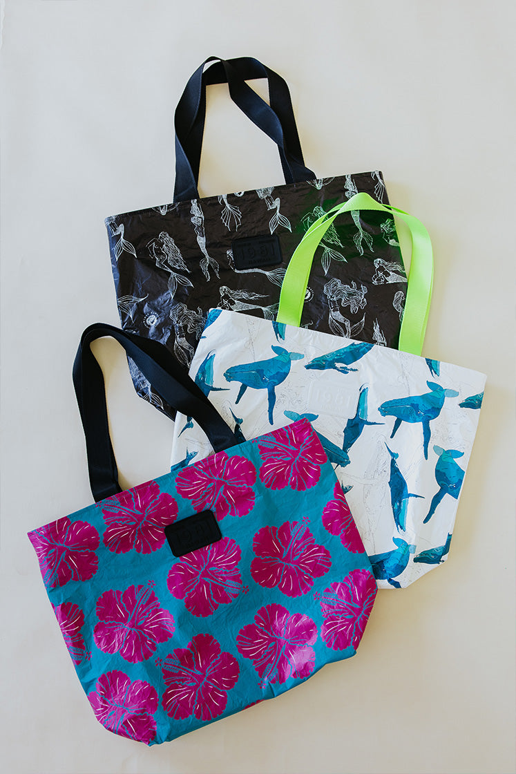 Collection of three Wings Hawaii adventure tote bags