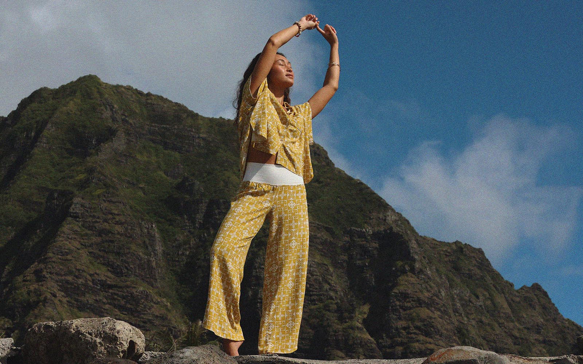 Model in a yellow ulu print set on a ridge