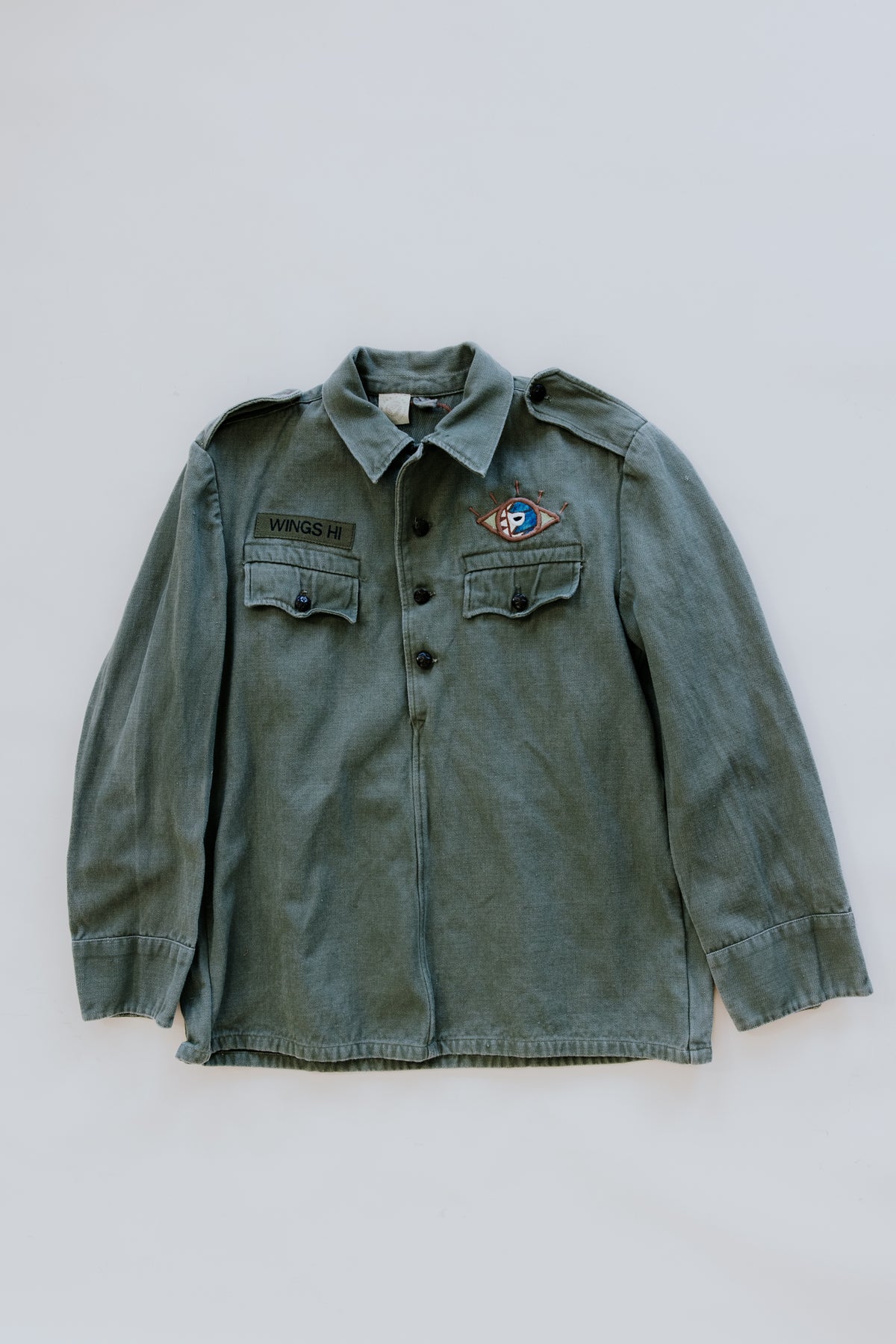 Wings Hawaii Moon Phase army green pullover jacket upcycled with vintage aloha fabric. Handcrafted in Maui. Small batch, sustainable, creative fashion handmade in Hawaii. 