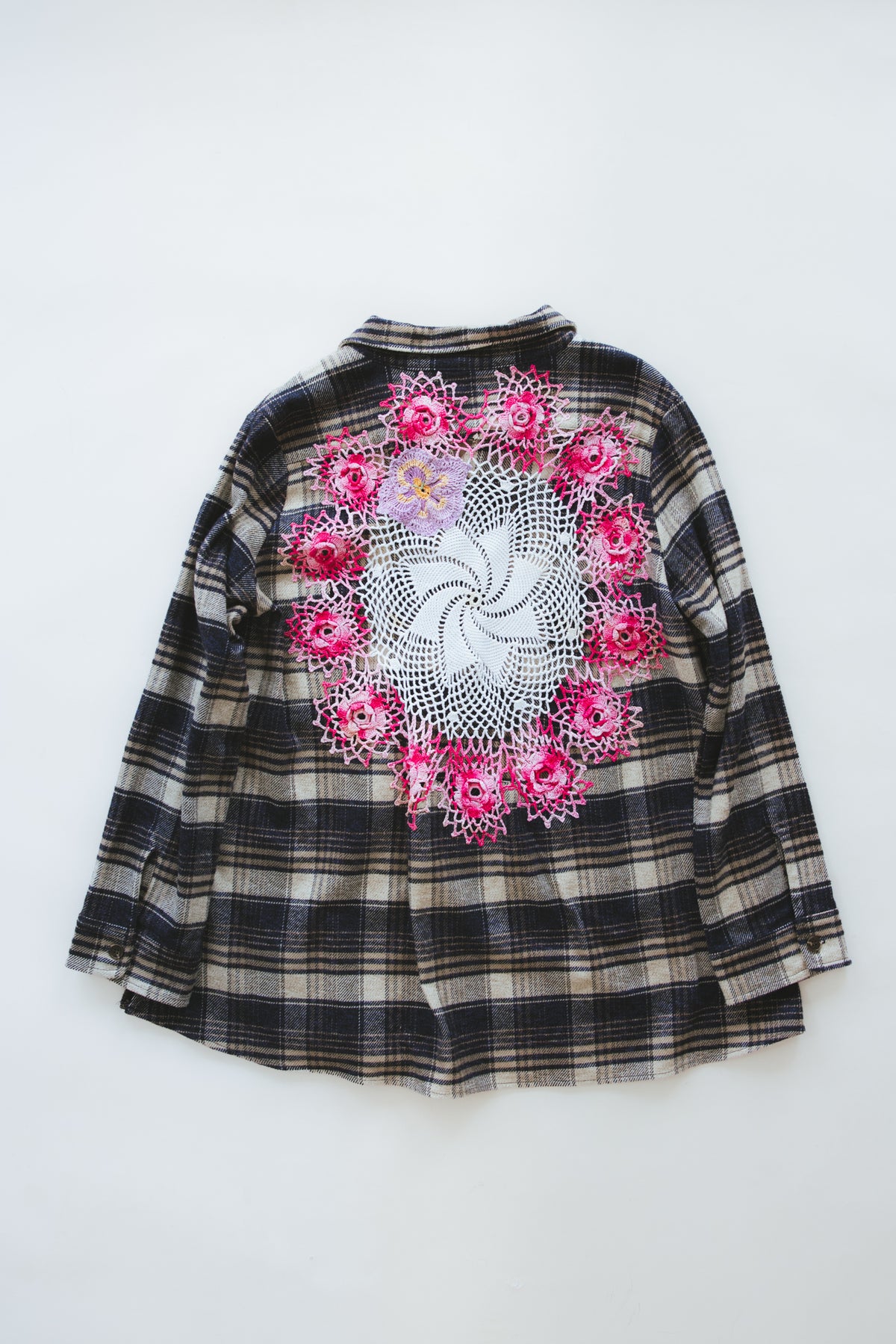 Wings Hawaii Paragon Flannel. 100% cotton button-up flannel with side pockets. Vintage crochet lace doily on back. Sewn in LA, designed and upcycled in Maui. 