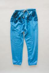 Wings Hawaii blue hibiscus joggers in bamboo french terry. Elevated loungewear  pants. Original artwork designed in Maui, hand sewn in Bali in small batches. Drawstring waist, mid-rise, pockets.  thumbnail