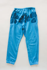 Wings Hawaii blue hibiscus joggers in bamboo french terry. Elevated loungewear  pants. Original artwork designed in Maui, hand sewn in Bali in small batches. Drawstring waist, mid-rise, pockets.  thumbnail