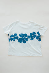 Wings Hawaii women's Hibiscus Tee in hemp. White with blue tropical floral print. Designed in Maui, made in Bali. Small batch, sustainable apparel. Vintage aloha style vibes.  thumbnail