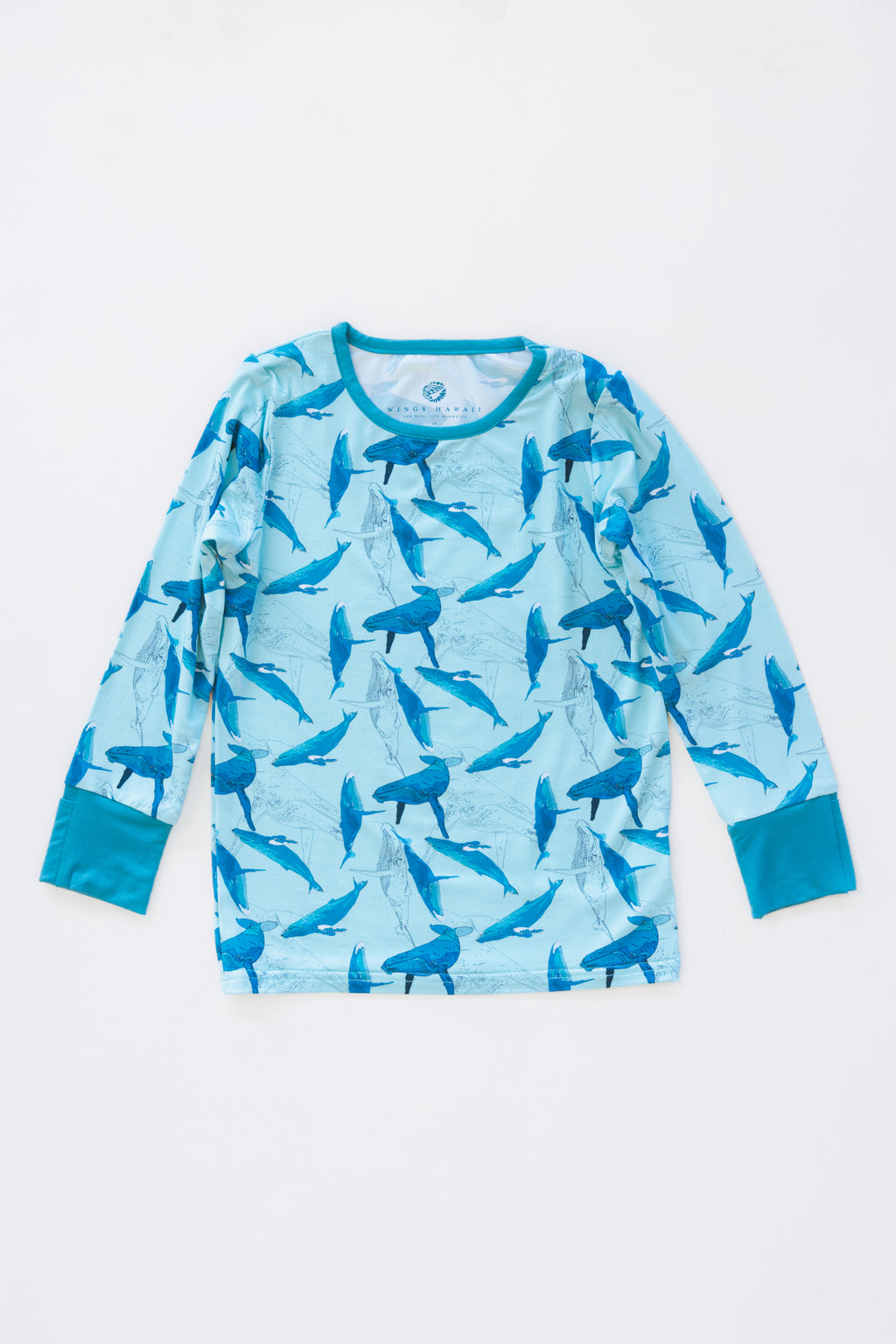 Wings Hawaii Kohola kids pajamas set with humpback whales print. Original artwork designed in Maui. Island style keiki gifts. Long sleeved shirt with pajama pants. Small batch, sustainable, unique children’s apparel. 