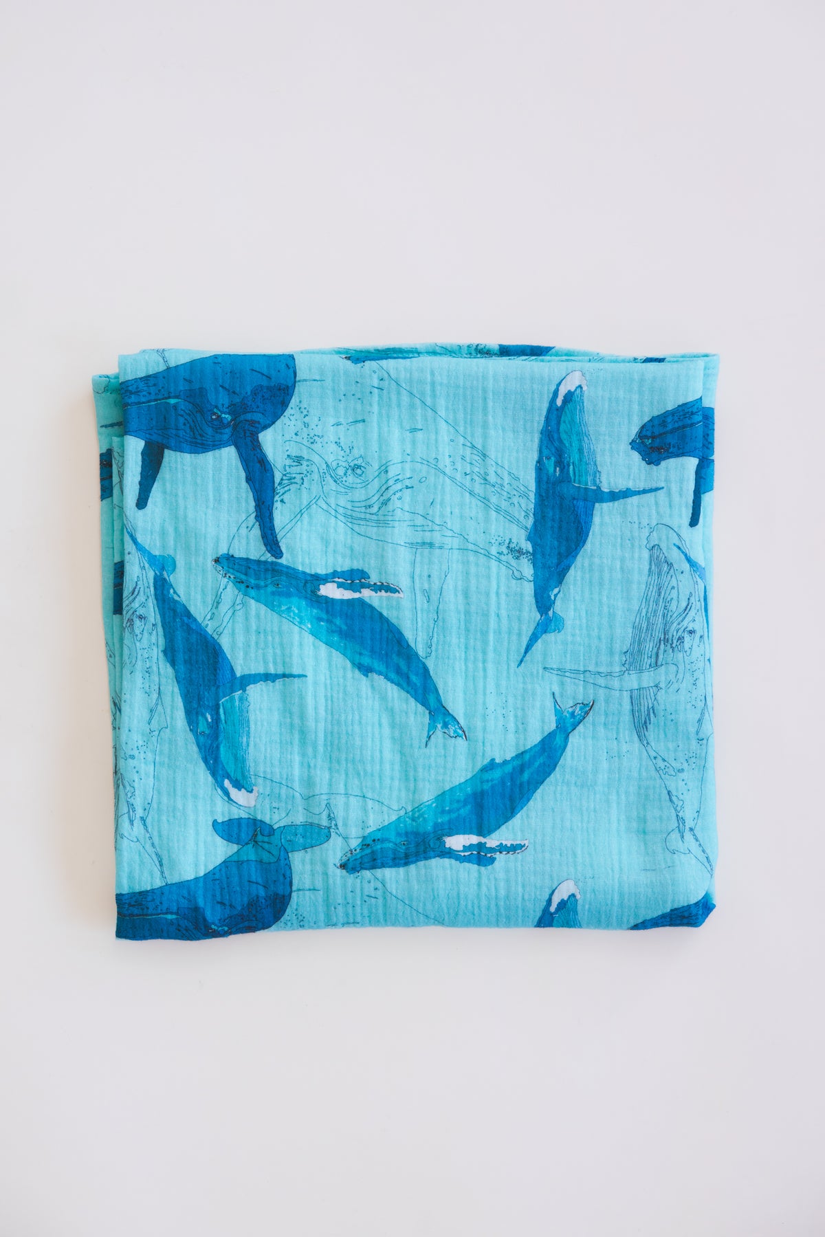 Wings Hawaii baby swaddle blanket with kohola humpback whale print. Original artwork designed in Maui. Best baby shower gifts, nursing cover, new mommy gifts. Island style keiki accessories. 