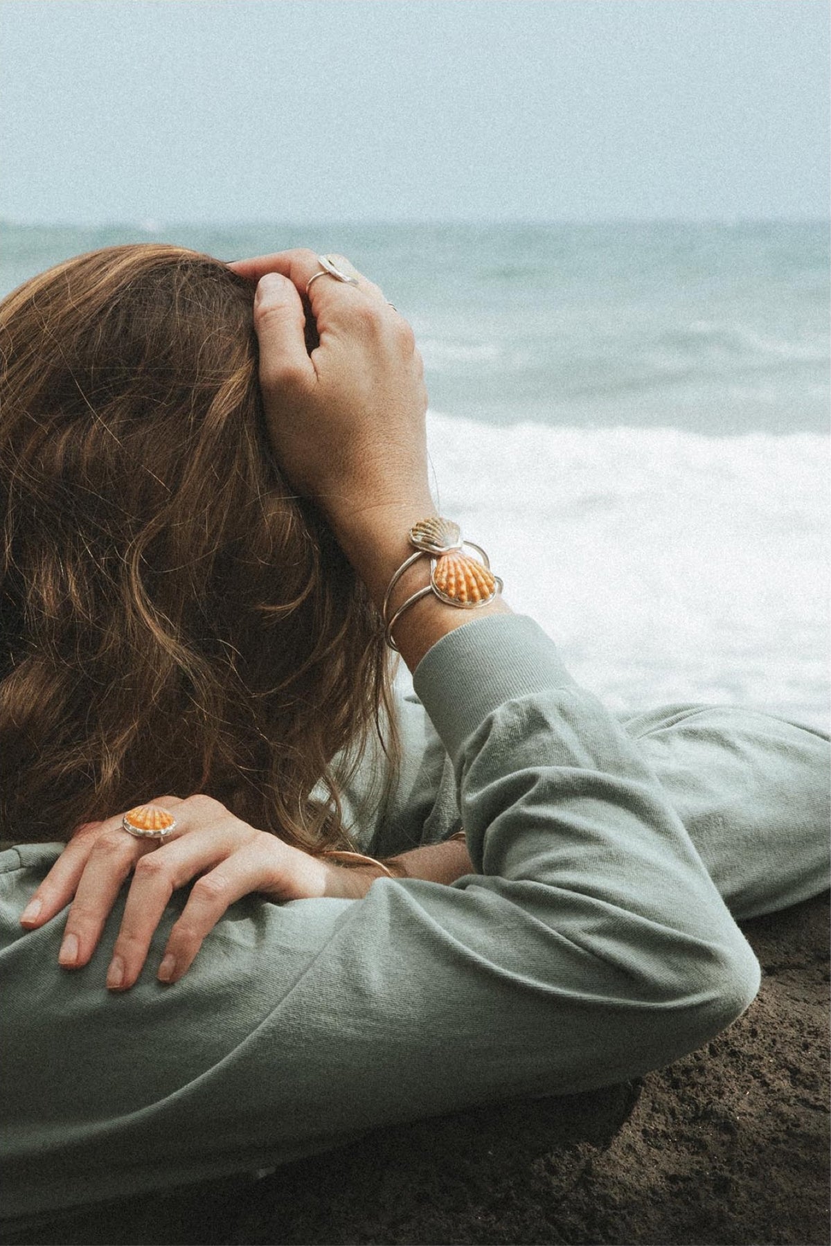 Model leaning on a rock