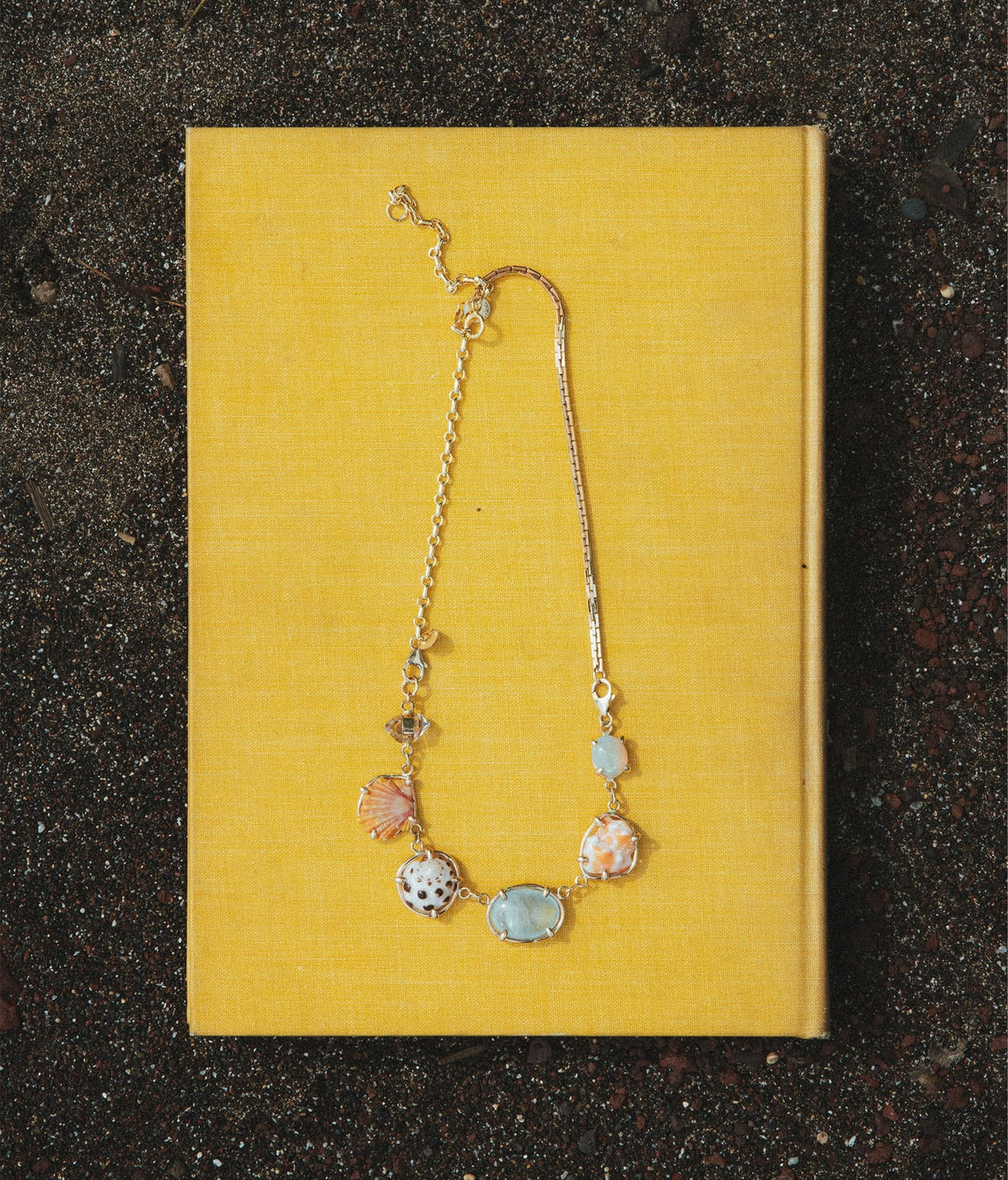 Necklace on a yellow book