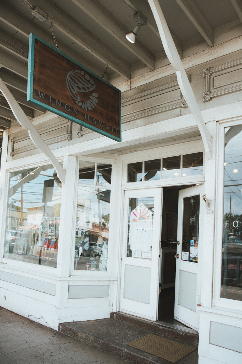The Wings Hawaii shop in Paia: the open door under the hanging Wings sign