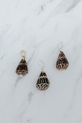 Wings Hawaii Chaldean Shell necklace charms in 14k gold-filled or sterling silver. Fine shell jewelry handcrafted in Maui. Modern beachy charm necklaces handmade with authentic Hawaiian sea shells. 