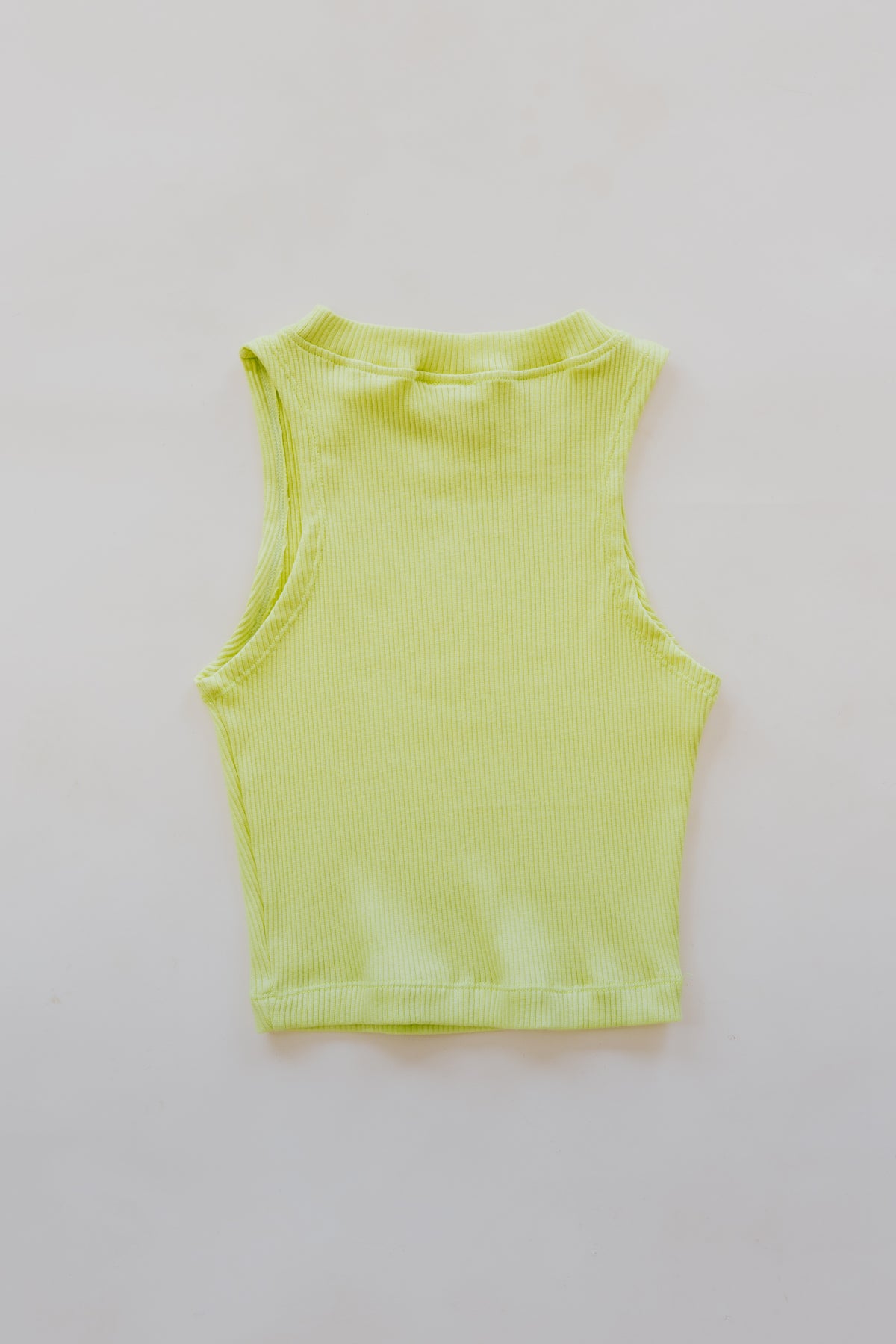Wings Hawaii Ribbed Lexi Tank Top. Stretchy high neck cropped muscle tank top in Lime green. Designed in Maui, sewn in Bali. Sustainable, small batch, boho beachy chic women's apparel. 