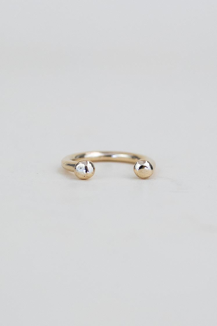 A Womens ring in the shape of a horse shoe