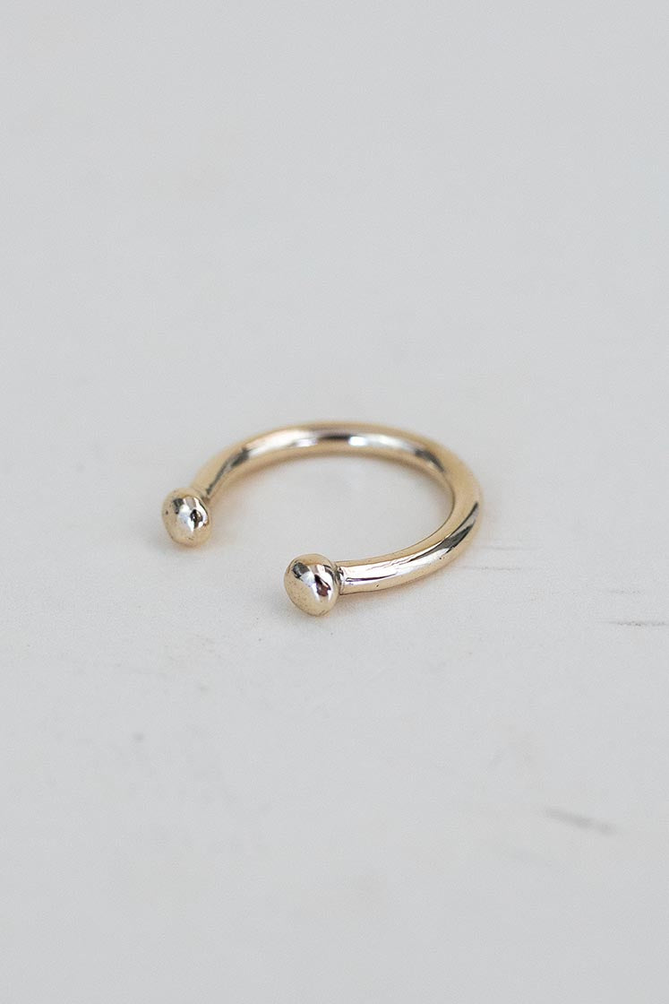 A Womens ring in the shape of a horse shoe