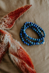 Wings Hawaii Lapis Lazuli stretchy beaded bracelet with 14k gold-filled tag. Crystal chakra healing. Boho-chic spiritual jewelry hand made in Maui. thumbnail