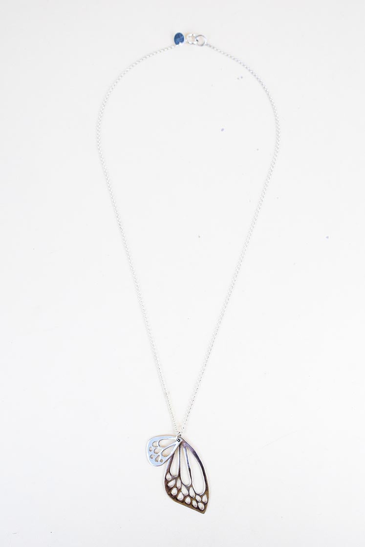 small and large butterfly wing made of sterling silver hanging on silver chain necklace