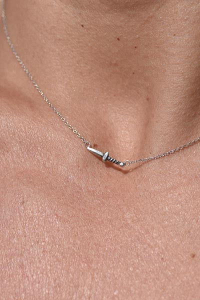 tiny dagger set on sterling silver chain