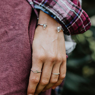 model wearing silver cuff bracelet with herkimer diamond stones and two silver rings