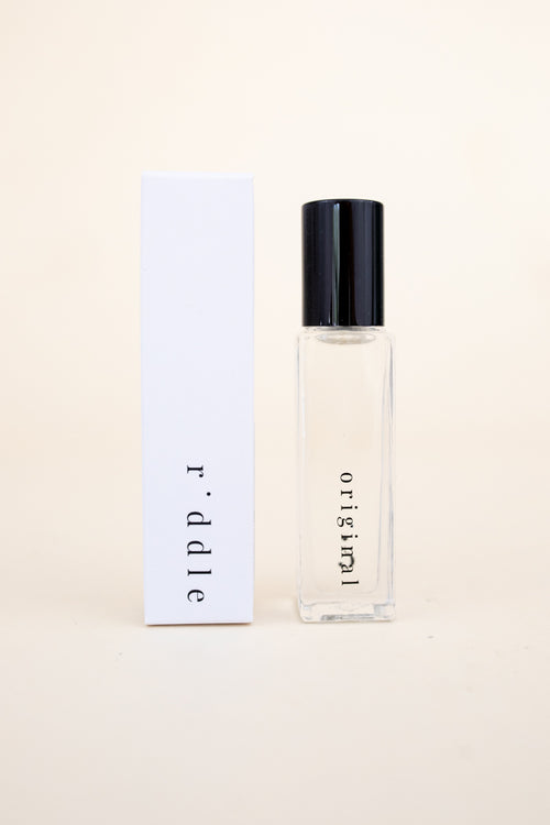 riddle oil. original scent. roll on perfume. 