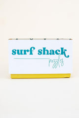 surf shack puzzle A super fun puzzle made of premium 100% recycled Eska board. Printed with non-toxic inks and a matte finish. Art by illustrator Kim Sielbeck based in Hawai'i.  thumbnail