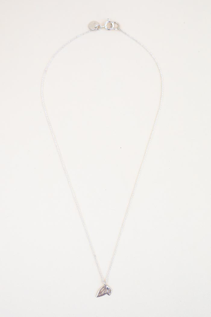 tiny butterfly wing necklace in sterling silver or 14k gold women's jewelry simple minimal elegant everyday pieces to wear and cherish hand made in haiku maui wings hawaii